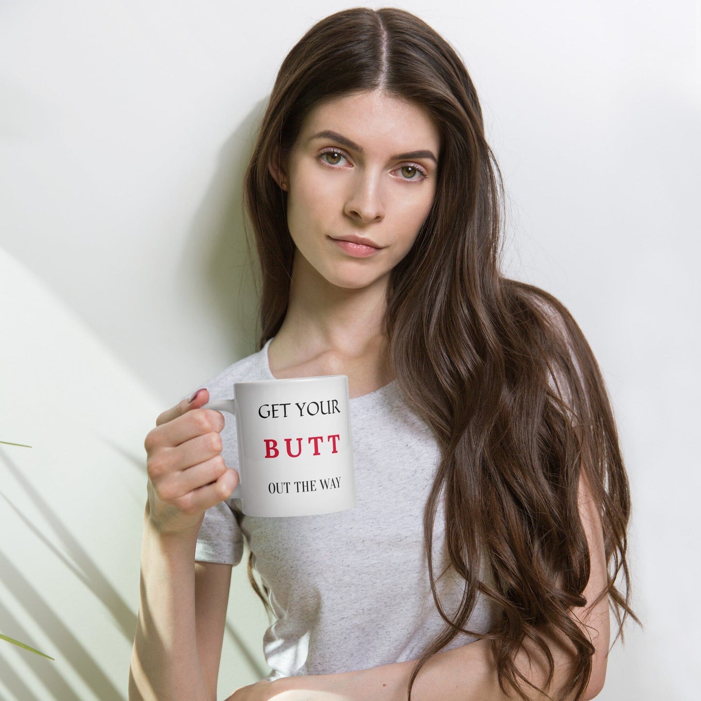 With an attention-grabbing Get Your BUTT Out The Way design, this white glossy mug is perfect to start your day off with enthusiasm. Enjoy your morning coffee, tea, or hot cocoa in a vibrant mug that will make you feel energized and motivated.